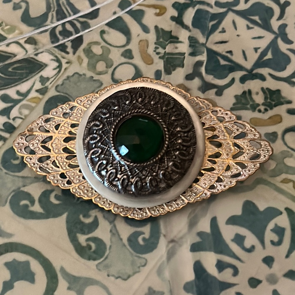 Brooch green stone looks like it was a button possibly vintage